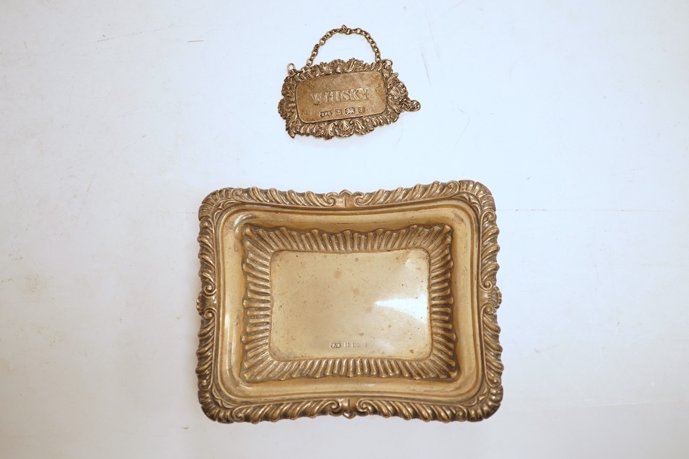 A collection of small silver including a pair of Edwardian rectangular dishes, Thomas Woolley, Birmingham, 1901, 13.2cm, a mug, two handled cup, cigarette case, photograph frame, toast rack, wine label, sovereign case et